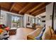 Bright living room with exposed beams, balcony access, comfortable seating, and modern décor at 5316 Burning Tree Dr # A09-2, Orlando, FL 32811