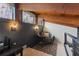 Loft sitting area with chair, rug, and view to the floor below at 5316 Burning Tree Dr # A09-2, Orlando, FL 32811