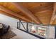 View from the loft to the floor below through wood beams at 5316 Burning Tree Dr # A09-2, Orlando, FL 32811
