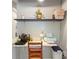 Efficient office space with floating shelves, compact desk, and natural light at 5316 Burning Tree Dr # A09-2, Orlando, FL 32811