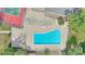 A top-down view of a community pool with crystal-clear water, surrounded by lounge chairs at 5316 Burning Tree Dr # A09-2, Orlando, FL 32811
