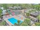 A scenic view of the pool and tennis courts; a great way to stay active at 5316 Burning Tree Dr # A09-2, Orlando, FL 32811