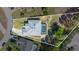 An aerial view of the property showcasing the house, surrounding yard and screened-in pool at 5524 Loma Vista, Davenport, FL 33896