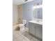 Bathroom with tiled floors, bathtub shower, toilet, and vanity with ample storage at 5524 Loma Vista, Davenport, FL 33896