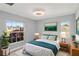 Charming bedroom featuring a large window, ceiling fan, wood floors and neutral paint at 5524 Loma Vista, Davenport, FL 33896