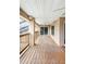 Covered outdoor deck with wood flooring and a ceiling fan at 5524 Loma Vista, Davenport, FL 33896