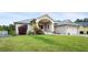 A inviting single-story home with manicured lawn and attractive landscaping enhancing curb appeal at 5524 Loma Vista, Davenport, FL 33896