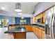 Bright kitchen features granite counters, stainless appliances, central island and eat in bar at 5524 Loma Vista, Davenport, FL 33896