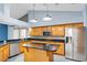 Bright kitchen features granite counters, stainless appliances, central island and eat in bar at 5524 Loma Vista, Davenport, FL 33896