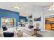 Bright living room with vaulted ceilings, an open floor plan, and access to outdoor deck at 5524 Loma Vista, Davenport, FL 33896