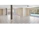 Open concept living space with tile flooring leading to outdoor pool access at 5524 Loma Vista, Davenport, FL 33896