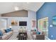 Cozy living room with high ceilings and slider doors out to the deck at 5524 Loma Vista, Davenport, FL 33896