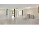 Spacious living room with ceiling fans, tile flooring, and serving bar area at 5524 Loma Vista, Davenport, FL 33896