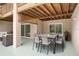 Covered outdoor patio with dining and lounge areas at 5524 Loma Vista, Davenport, FL 33896