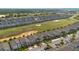Beautiful aerial view of a neighborhood next to a golf course, showcasing the homes and community at 581 Pebble Beach Dr, Davenport, FL 33896