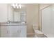 Bathroom showcasing a single sink vanity, toilet, and glass-enclosed shower at 581 Pebble Beach Dr, Davenport, FL 33896