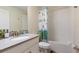 Bathroom featuring a single sink vanity and a shower/tub with a curtain at 581 Pebble Beach Dr, Davenport, FL 33896
