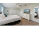 This spacious bedroom features a king bed, ample closet space, and modern television at 581 Pebble Beach Dr, Davenport, FL 33896