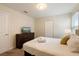 Bedroom with a queen bed, dresser with TV, and double closet at 581 Pebble Beach Dr, Davenport, FL 33896