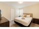 Bedroom with a queen-sized bed, closet and carpeted floor at 581 Pebble Beach Dr, Davenport, FL 33896