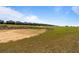 Beautiful view of the golf course community with well manicured greens and lush landscaping at 581 Pebble Beach Dr, Davenport, FL 33896
