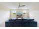 Relaxing entertainment room featuring a large sectional sofa, modern TV, and neutral decor at 581 Pebble Beach Dr, Davenport, FL 33896