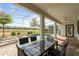 Outdoor patio has seating and a spa with a clear view of the community golf course at 581 Pebble Beach Dr, Davenport, FL 33896