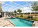 Relax in this beautiful pool with a jacuzzi and a screened-in enclosure at 581 Pebble Beach Dr, Davenport, FL 33896