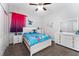 Brightly decorated bedroom with plush carpeting and a large closet at 7629 Marietta St, Orlando, FL 32807