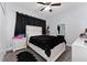 Cozy bedroom with plush carpeting, a comfortable bed, and stylish black-out curtains at 7629 Marietta St, Orlando, FL 32807