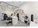 Bright home studio with multiple work stations, a coffee bar, and ample storage, perfect for creative pursuits at 7629 Marietta St, Orlando, FL 32807