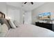 Bedroom featuring a dark wood bed frame and television at 7665 Fairfax Dr, Kissimmee, FL 34747