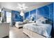 Whimsical bedroom featuring two beds, a mural, and themed decor for a fun and immersive experience at 7665 Fairfax Dr, Kissimmee, FL 34747