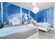Charming bedroom featuring two beds, a mural, and themed decor for a fun and immersive experience at 7665 Fairfax Dr, Kissimmee, FL 34747