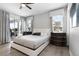 Bright bedroom with a sliding glass door, queen bed, and ceiling fan at 7665 Fairfax Dr, Kissimmee, FL 34747