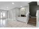 Spacious hallway with tiled floors, stairs to second floor, and a charming coffee bar on the right at 7665 Fairfax Dr, Kissimmee, FL 34747
