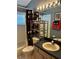 Clean bathroom with shower, vanity, and stylish Mickey Mouse themed decor at 8074 Santee Dr, Kissimmee, FL 34747