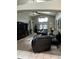 Spacious living room with cathedral ceiling, ceiling fans, and comfortable leather seating at 8074 Santee Dr, Kissimmee, FL 34747