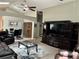 Open concept living space showcasing dining area, living room, and entertainment center at 8074 Santee Dr, Kissimmee, FL 34747