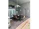 Spacious covered patio with dining set and grill, perfect for outdoor entertaining at 8074 Santee Dr, Kissimmee, FL 34747