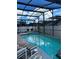 Beautiful view of the enclosed pool with a spa perfect for hot days at 8074 Santee Dr, Kissimmee, FL 34747