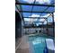Relaxing screened-in pool area with a spa, offering a private outdoor oasis at 8074 Santee Dr, Kissimmee, FL 34747