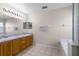 Bathroom featuring double sink vanity and bright lighting at 814 Bloomingdale Dr, Davenport, FL 33897