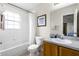 Standard bathroom with a vanity sink, toilet, and shower-tub combo, perfect for everyday needs at 814 Bloomingdale Dr, Davenport, FL 33897