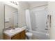 Clean bathroom featuring a shower-tub combo with white tiling, a standard toilet, and a vanity at 814 Bloomingdale Dr, Davenport, FL 33897