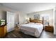 Bedroom with wooden furniture set, light walls, and wood floors at 814 Bloomingdale Dr, Davenport, FL 33897