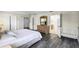 Bedroom features wood floors, TV on dresser, a closet and a crib at 814 Bloomingdale Dr, Davenport, FL 33897