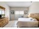 Comfortable bedroom with tile flooring, a double bed, natural light, and a dresser with a TV at 814 Bloomingdale Dr, Davenport, FL 33897