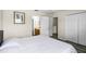 Bedroom with neutral walls and wood floors, including an en suite bath and closet at 814 Bloomingdale Dr, Davenport, FL 33897