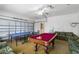 Bright and open game room has both pool and ping pong tables, and lots of seating at 814 Bloomingdale Dr, Davenport, FL 33897